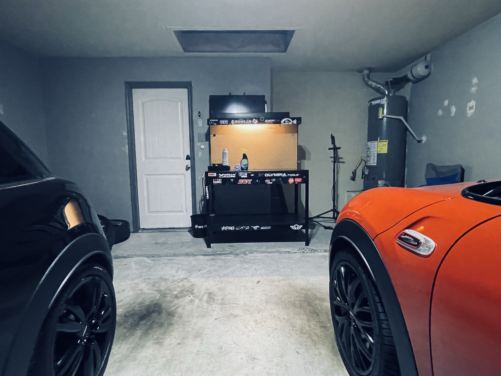 Clean shop with polyaspartic-coated floor, MINI and BBS banners on the wall